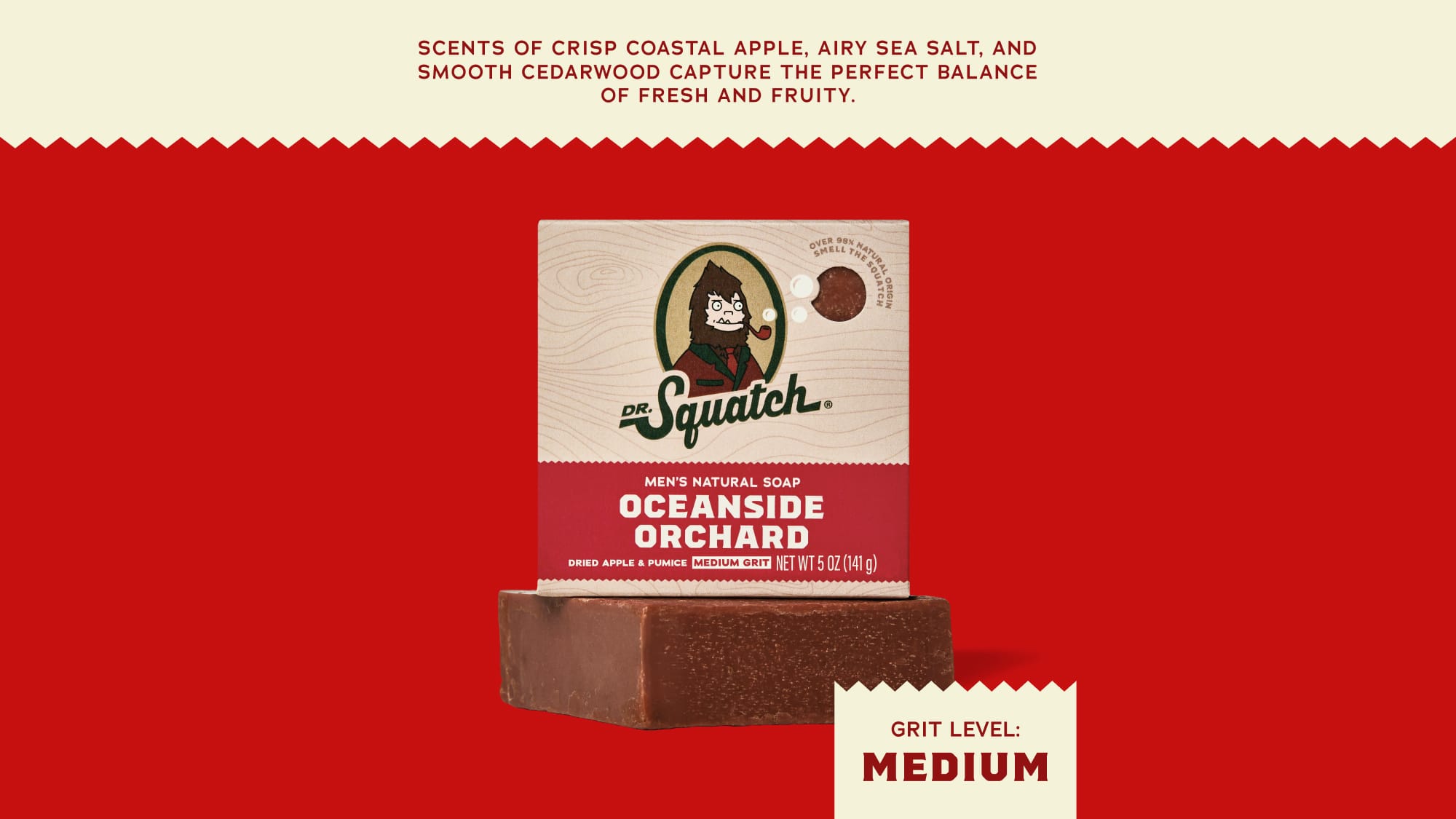 A bar of Squatch Men's Natural Soap in the Oceanside Orchard scent, shown with its packaging box against a solid red background